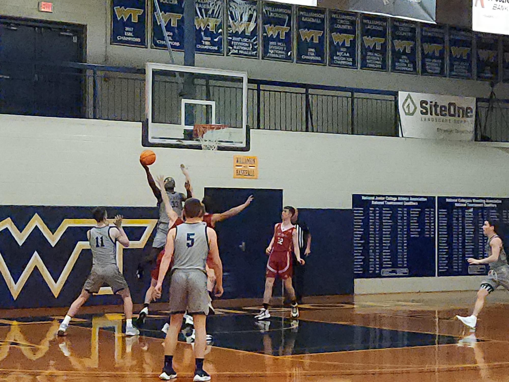 Semaj Chery hits a reverse lay-up as part of his team leading 22 points in Williamson's win over The Crown College
